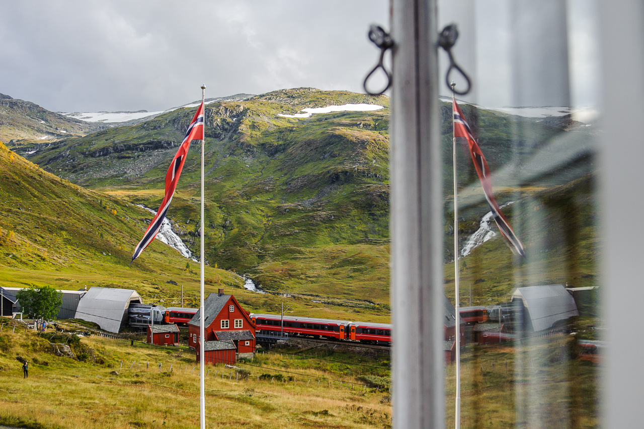 Train 64 passes Upsete, entering Gravhalsen tunnel towards Myrdal. When built, the tunnel was the longest in the country when it was opened in 1906.